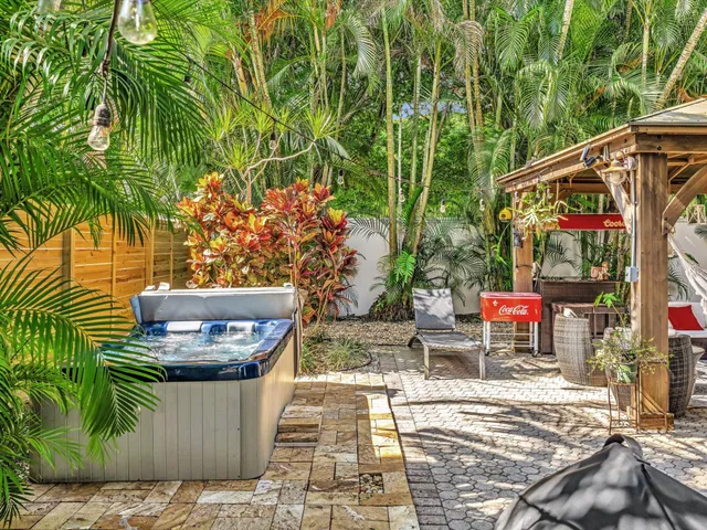 an aerial view of a house with a yard and lake view
