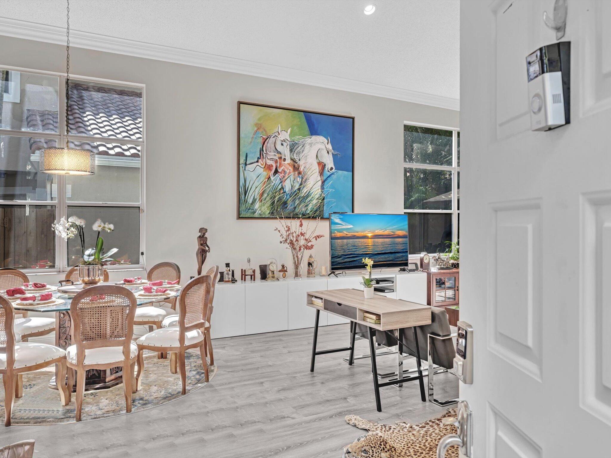 2486 Northwest 66th Drive Boca Raton, FL 33496 - Photo 4 of 80 a work room with furniture and wooden floor