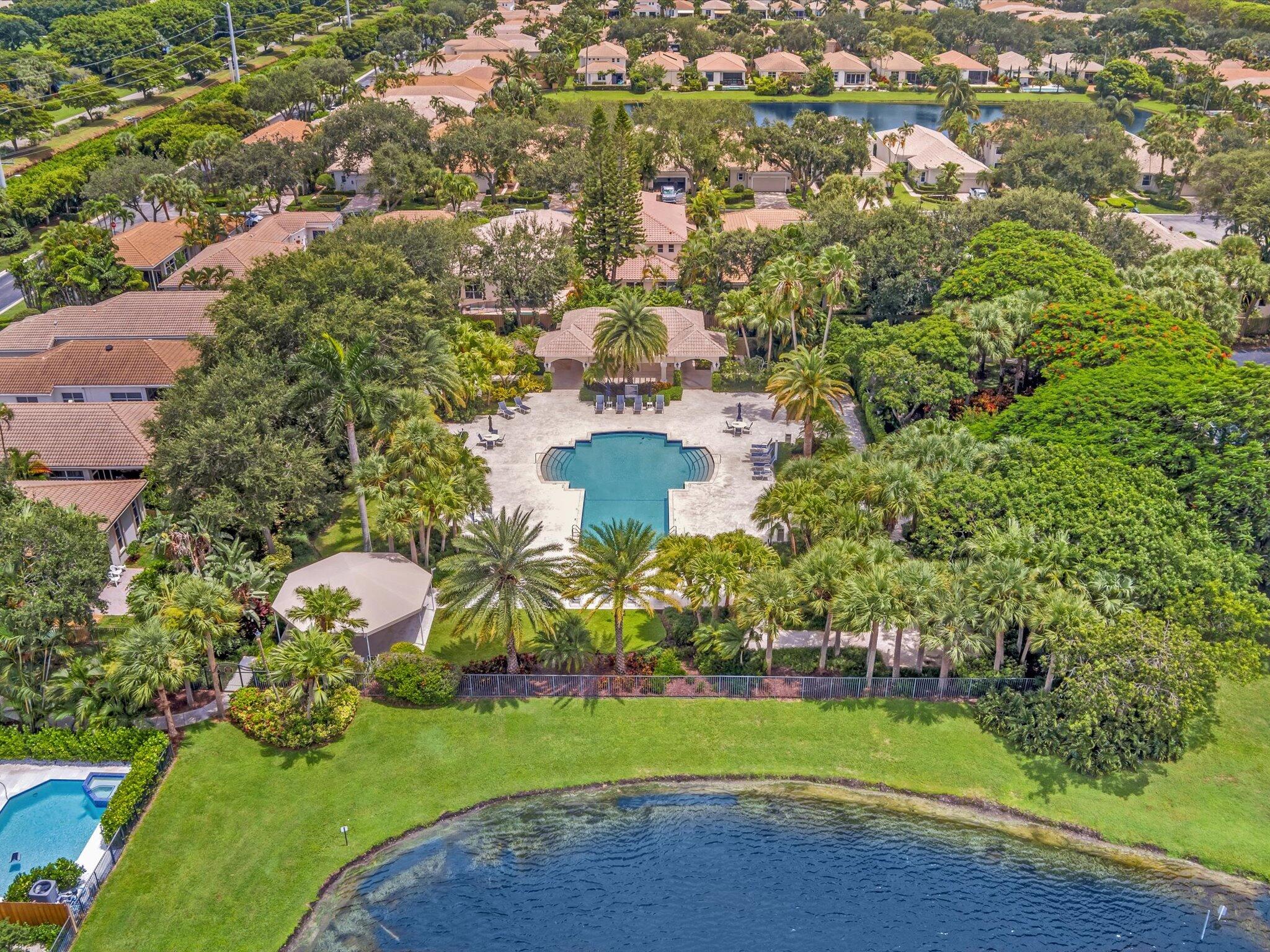 2486 Northwest 66th Drive Boca Raton, FL 33496 - Photo 49 of 80 an aerial view of a house with a yard and lake view
