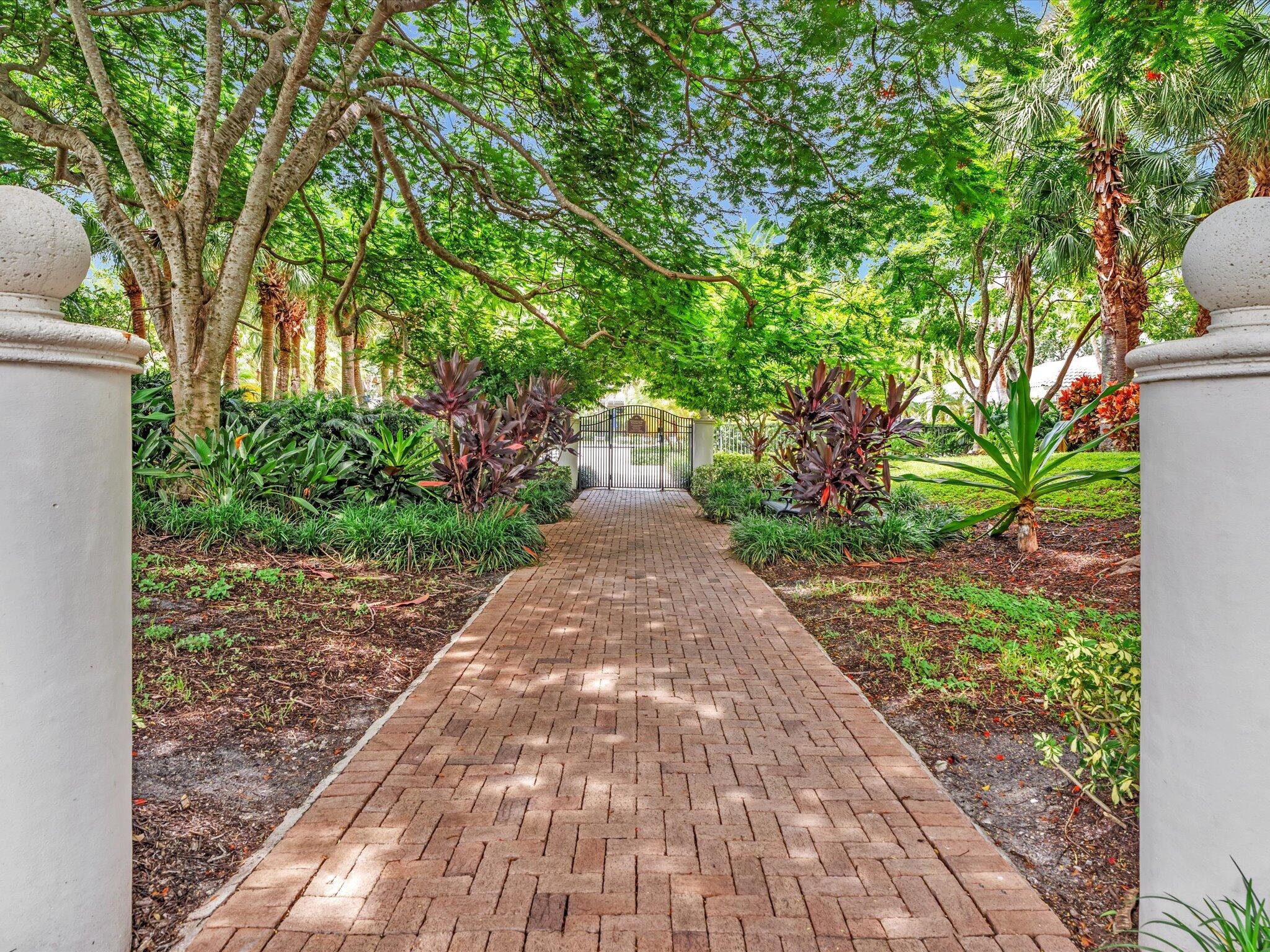2486 Northwest 66th Drive Boca Raton, FL 33496 - Photo 77 of 80 a front view of a house with a yard and fountain