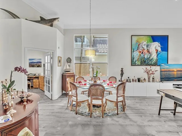 a living room with furniture fireplace and a window