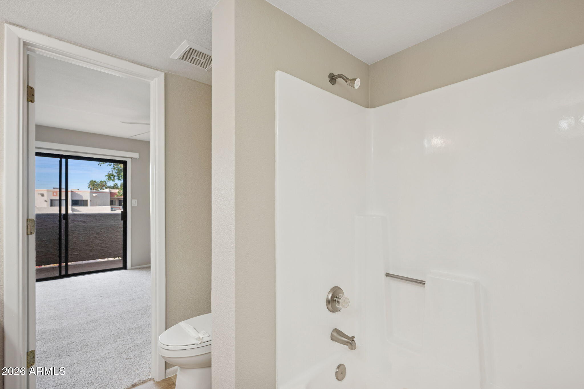 935 North Granite Reef Road, Unit 89 Scottsdale, AZ 85257 - Photo 16 of 32 a bathroom with a shower a toilet and a sink