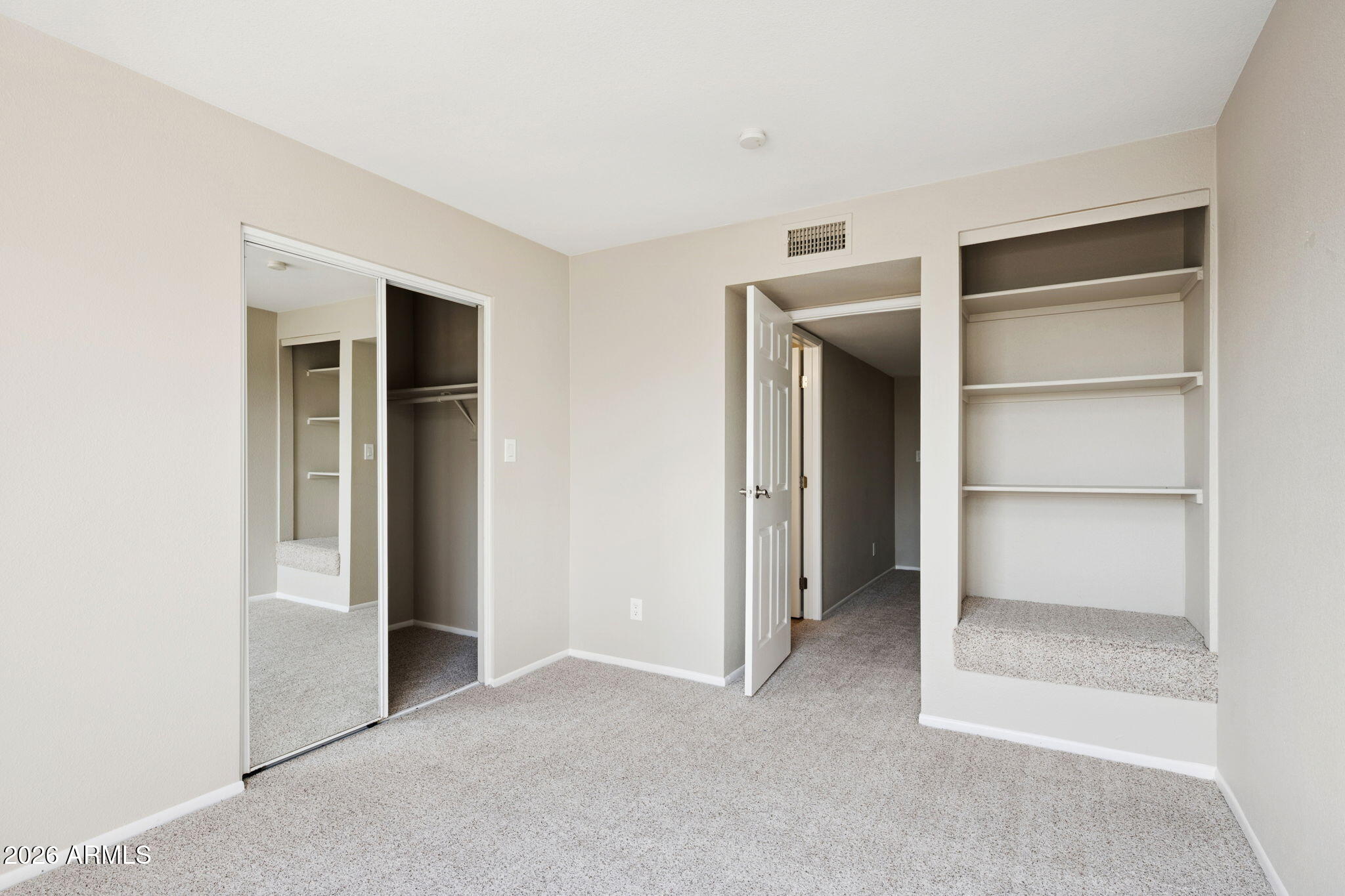 935 North Granite Reef Road, Unit 89 Scottsdale, AZ 85257 - Photo 19 of 32 a view of an empty room and closet with cabinet