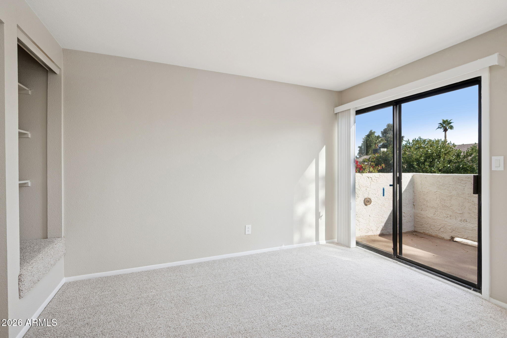 935 North Granite Reef Road, Unit 89 Scottsdale, AZ 85257 - Photo 20 of 32 a view of a room with a large window and hardwood floor