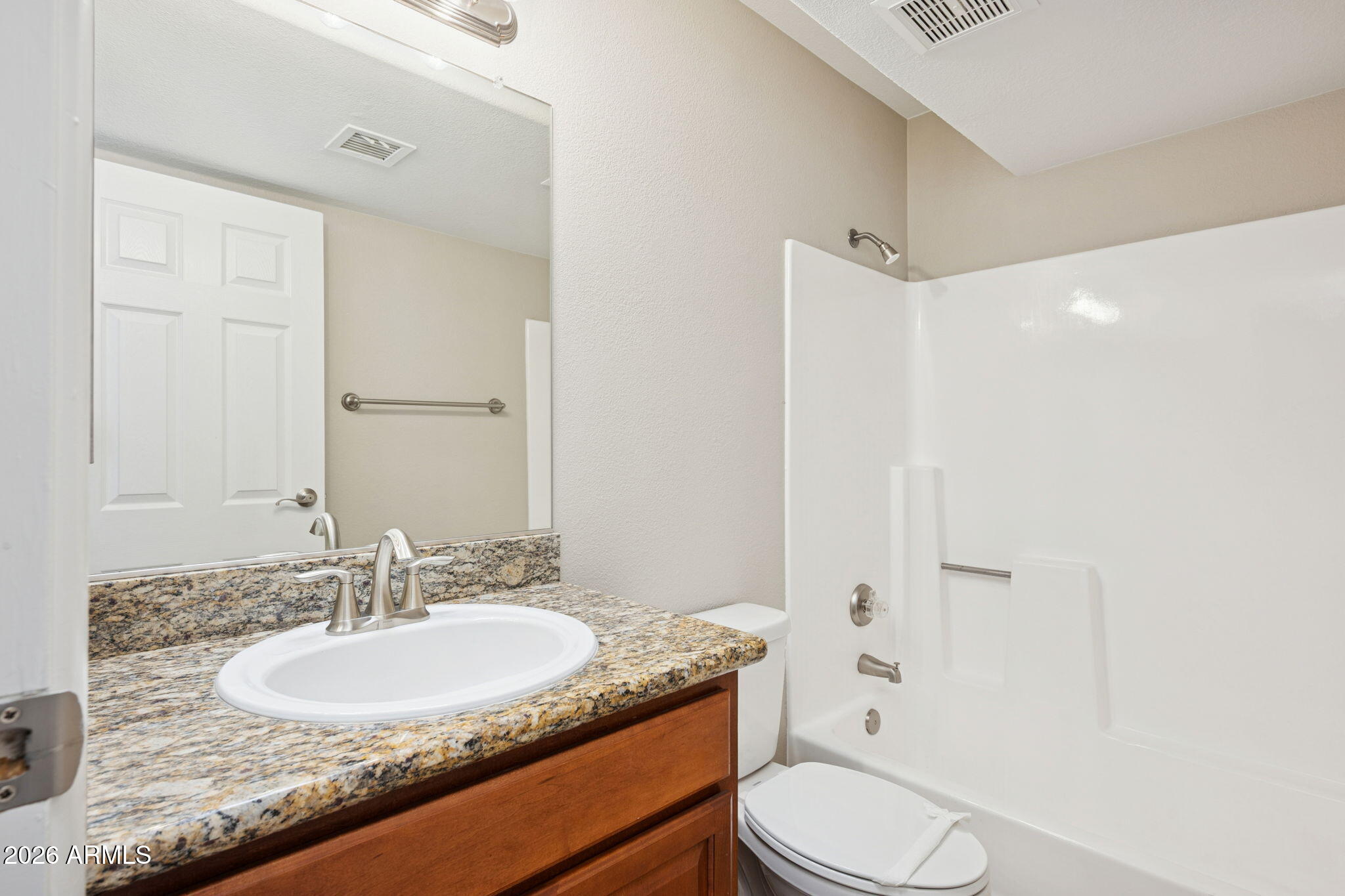 935 North Granite Reef Road, Unit 89 Scottsdale, AZ 85257 - Photo 21 of 32 a bathroom with a granite countertop sink toilet and shower