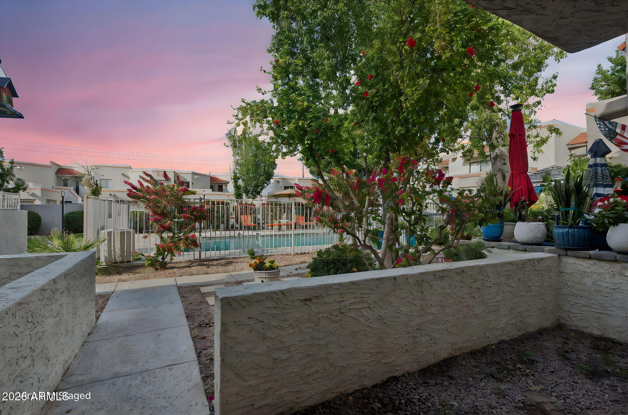 935 North Granite Reef Road, Unit 89 Scottsdale, AZ 85257 - Photo 26 of 32 a view of a patio with couches and table and chairs and potted plants