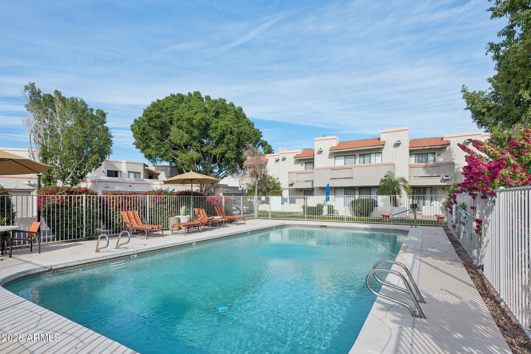 935 North Granite Reef Road, Unit 89 Scottsdale, AZ 85257 - Photo 29 of 32 a swimming pool view with a outdoor seating