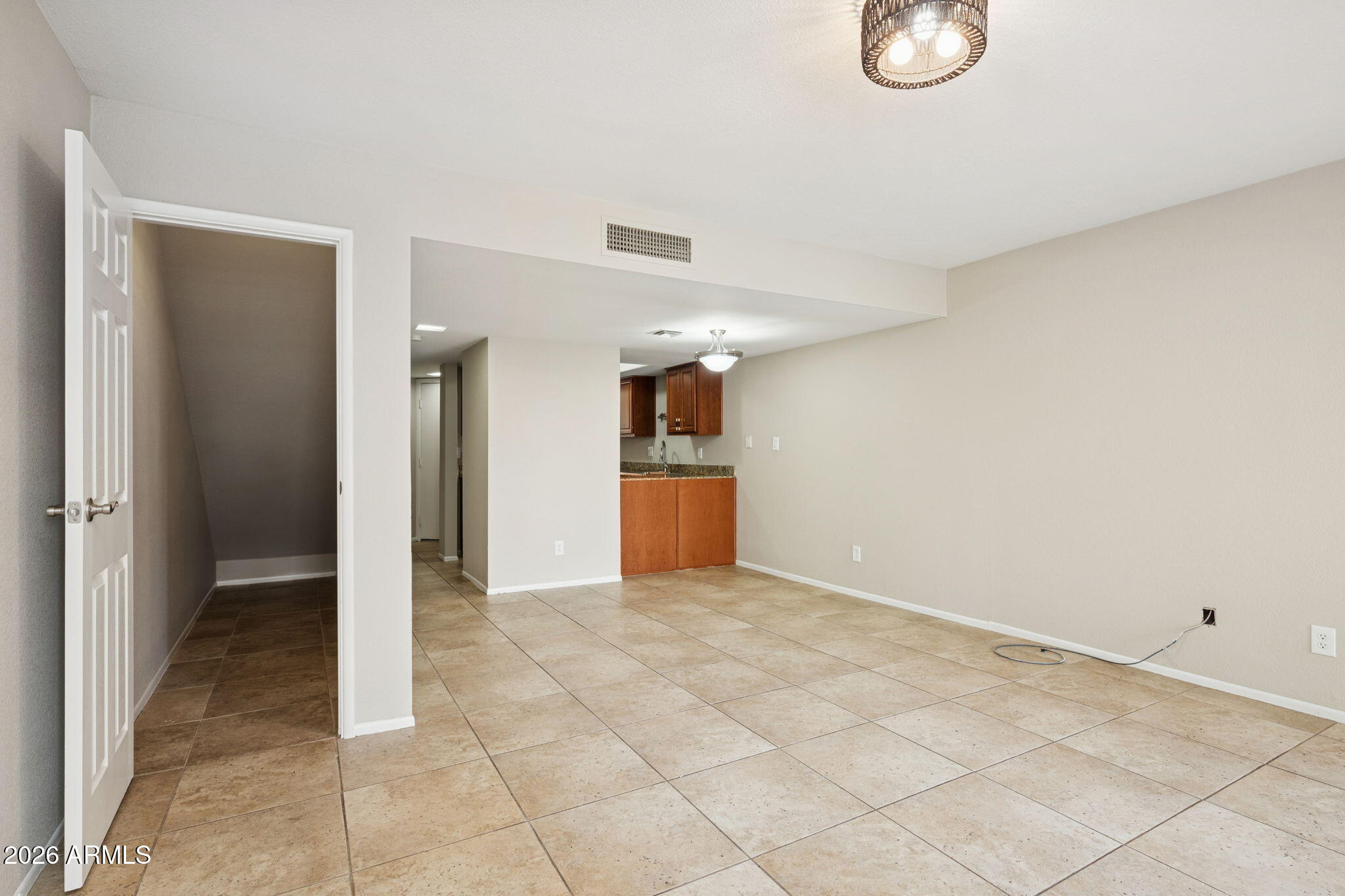 935 North Granite Reef Road, Unit 89 Scottsdale, AZ 85257 - Photo 3 of 32 a view of a livingroom with wooden floor and kitchen space