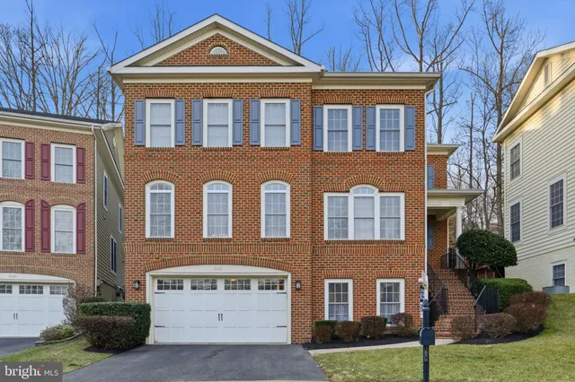 a front view of a house with yard