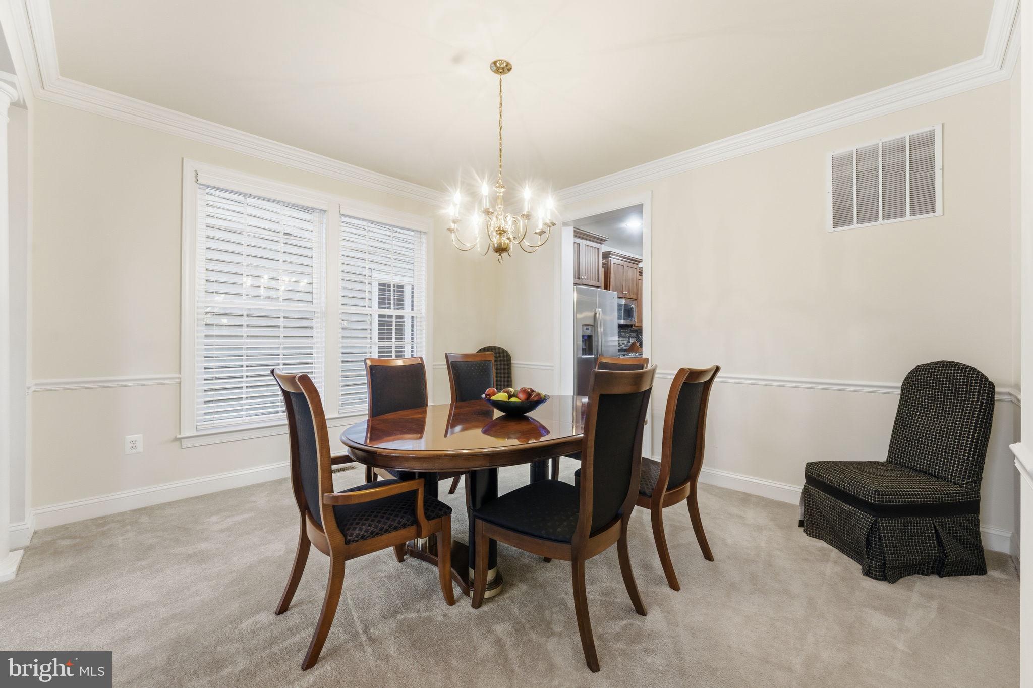 7669 Oak Field Court Springfield, VA 22153 - Photo 14 of 57 a view of a dining room with furniture and window