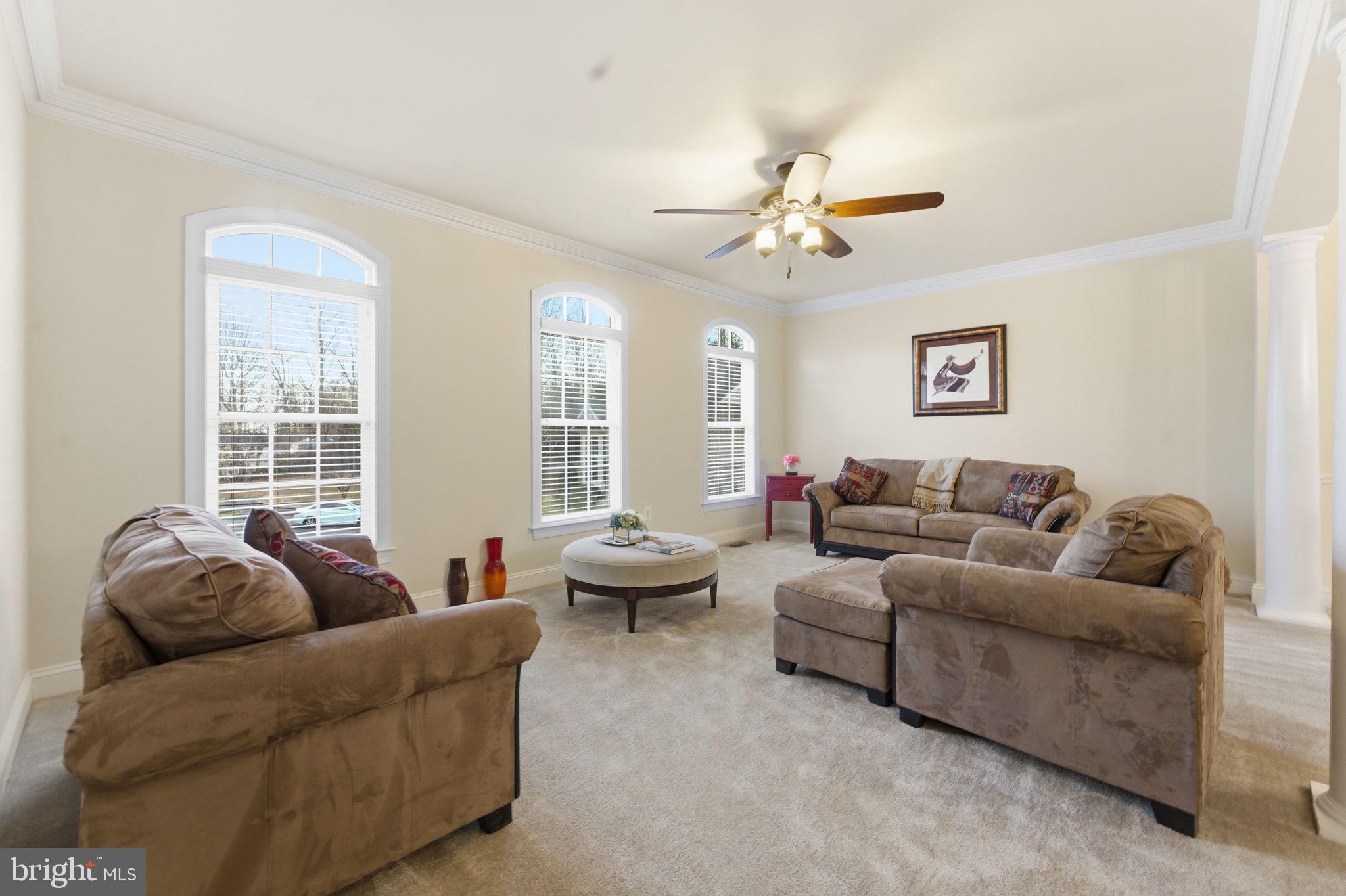 7669 Oak Field Court Springfield, VA 22153 - Photo 20 of 57 a living room with furniture and a large window
