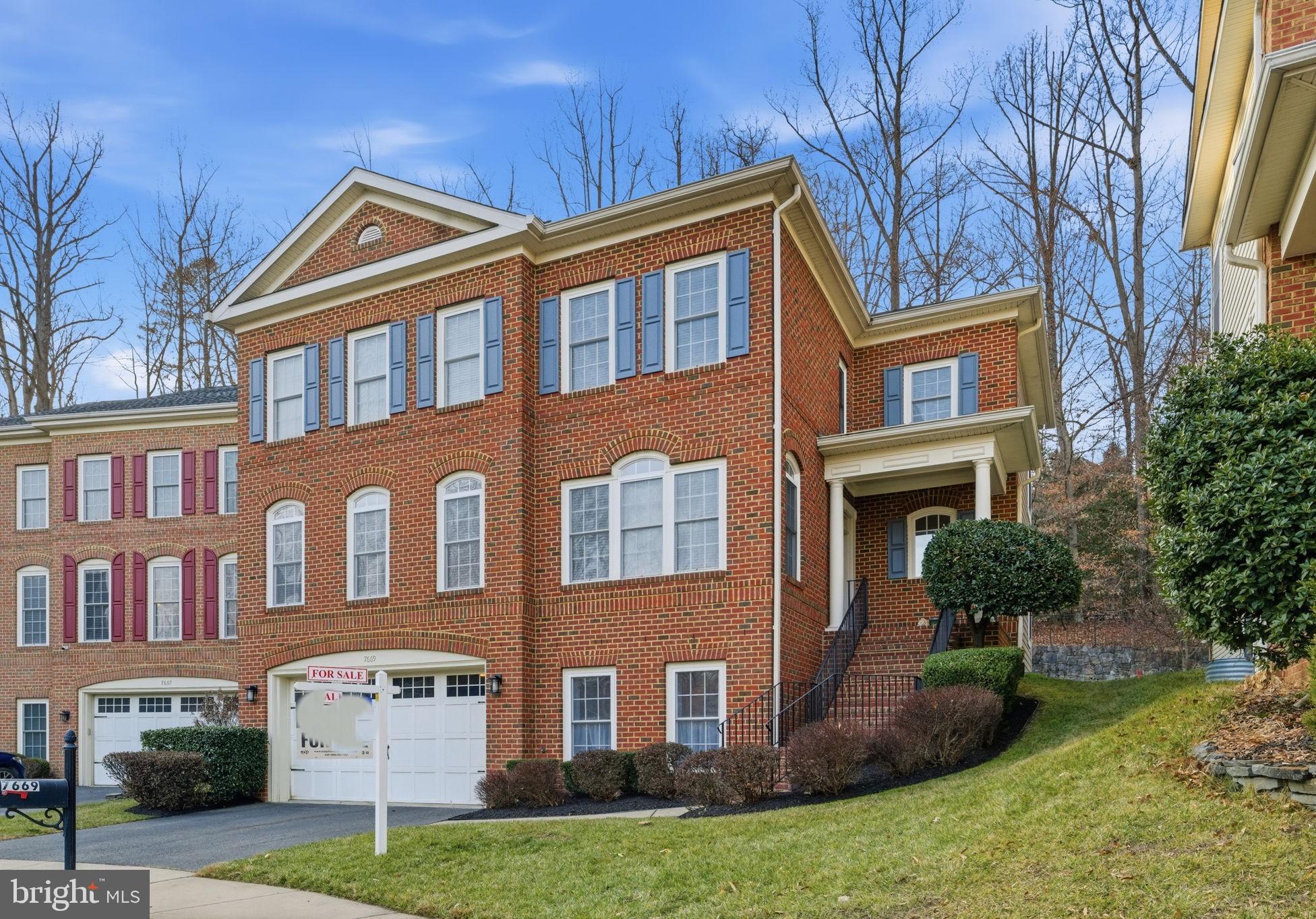 7669 Oak Field Court Springfield, VA 22153 - Photo 2 of 57 a front view of a house
