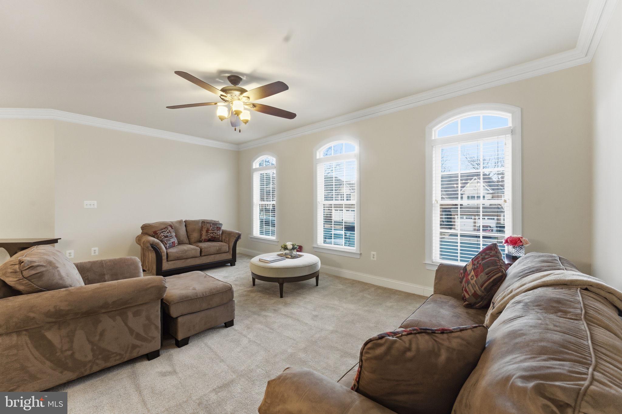 7669 Oak Field Court Springfield, VA 22153 - Photo 21 of 57 a living room with furniture and a large window
