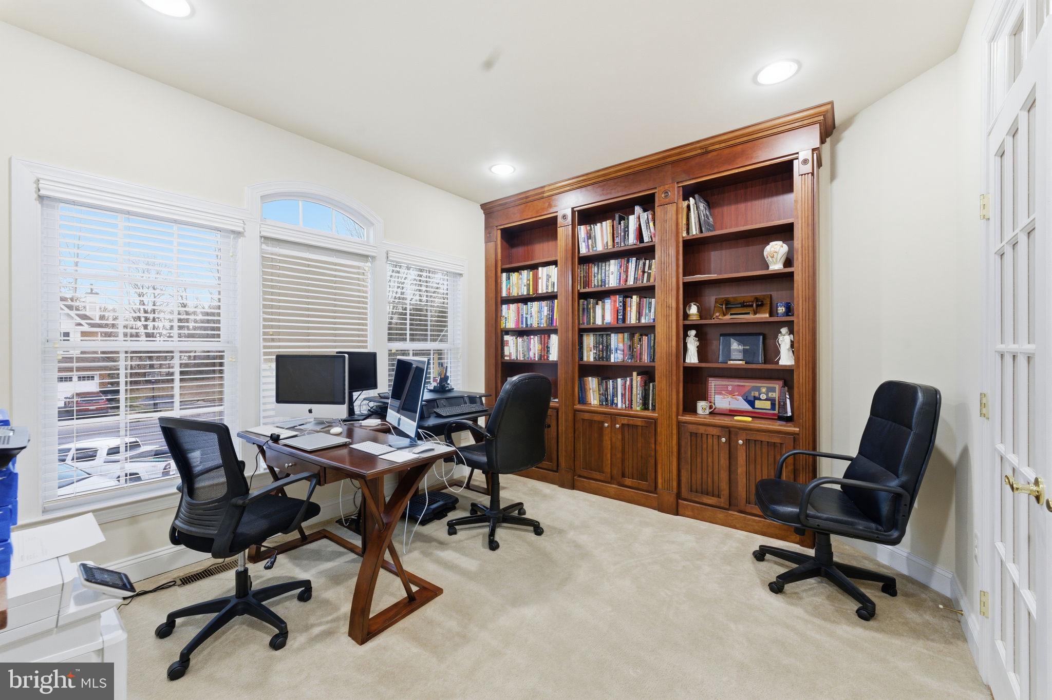 7669 Oak Field Court Springfield, VA 22153 - Photo 22 of 57 a view of a workspace with furniture and a window