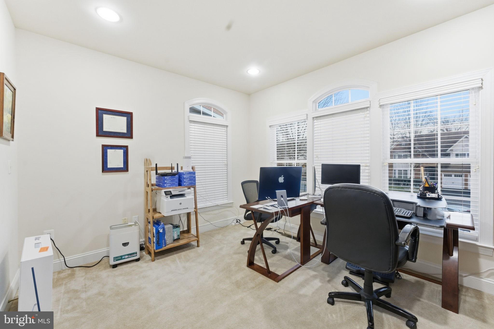 7669 Oak Field Court Springfield, VA 22153 - Photo 23 of 57 a view of a workspace with furniture and a window