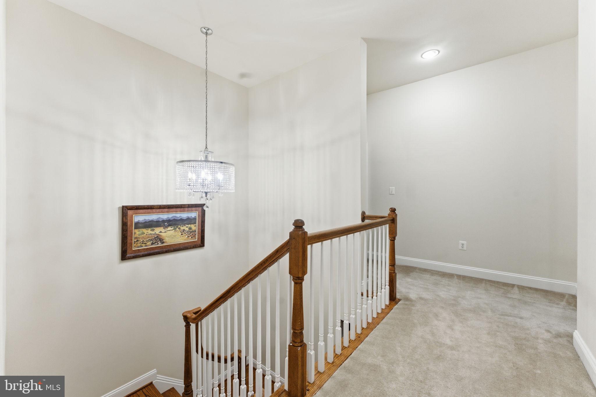 7669 Oak Field Court Springfield, VA 22153 - Photo 26 of 57 a view of a hallway with staircase
