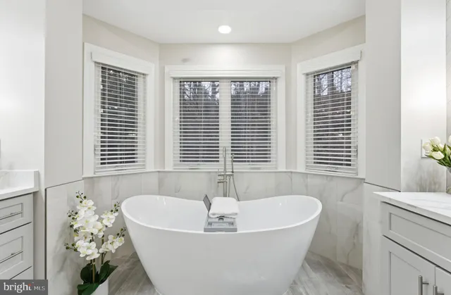 a bedroom with a bed and a flat tv screen