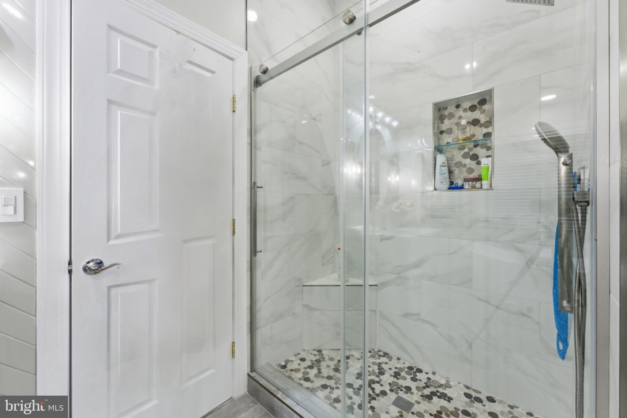 7669 Oak Field Court Springfield, VA 22153 - Photo 33 of 57 a bathroom with a shower