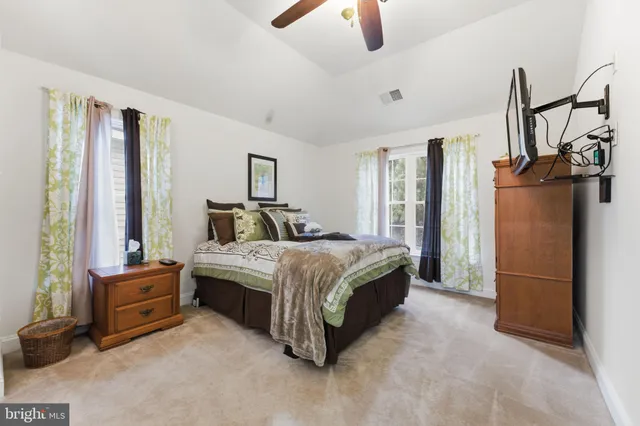 a spacious bathroom with a sink double vanity and a mirror