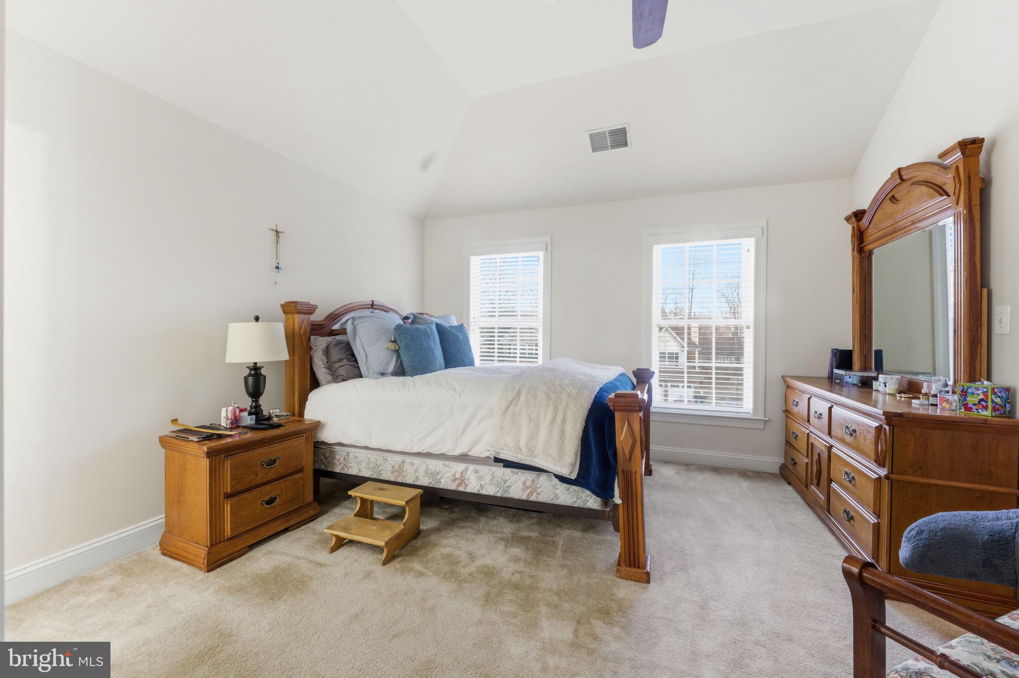 7669 Oak Field Court Springfield, VA 22153 - Photo 41 of 57 a bedroom with a bed and a window