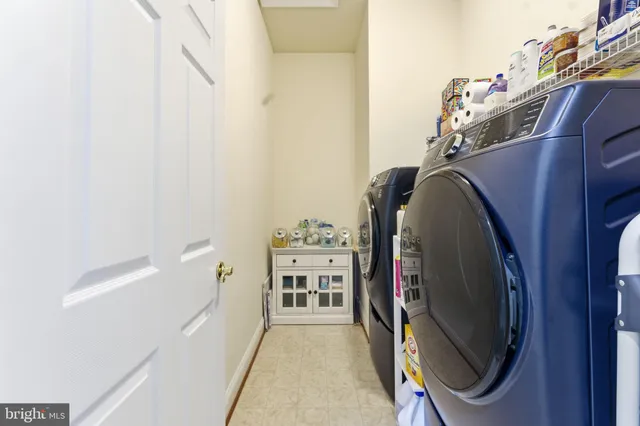 a kitchen with stainless steel appliances granite countertop wooden cabinets a sink and a window
