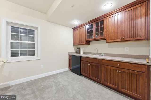 a backyard of a house with outdoor seating