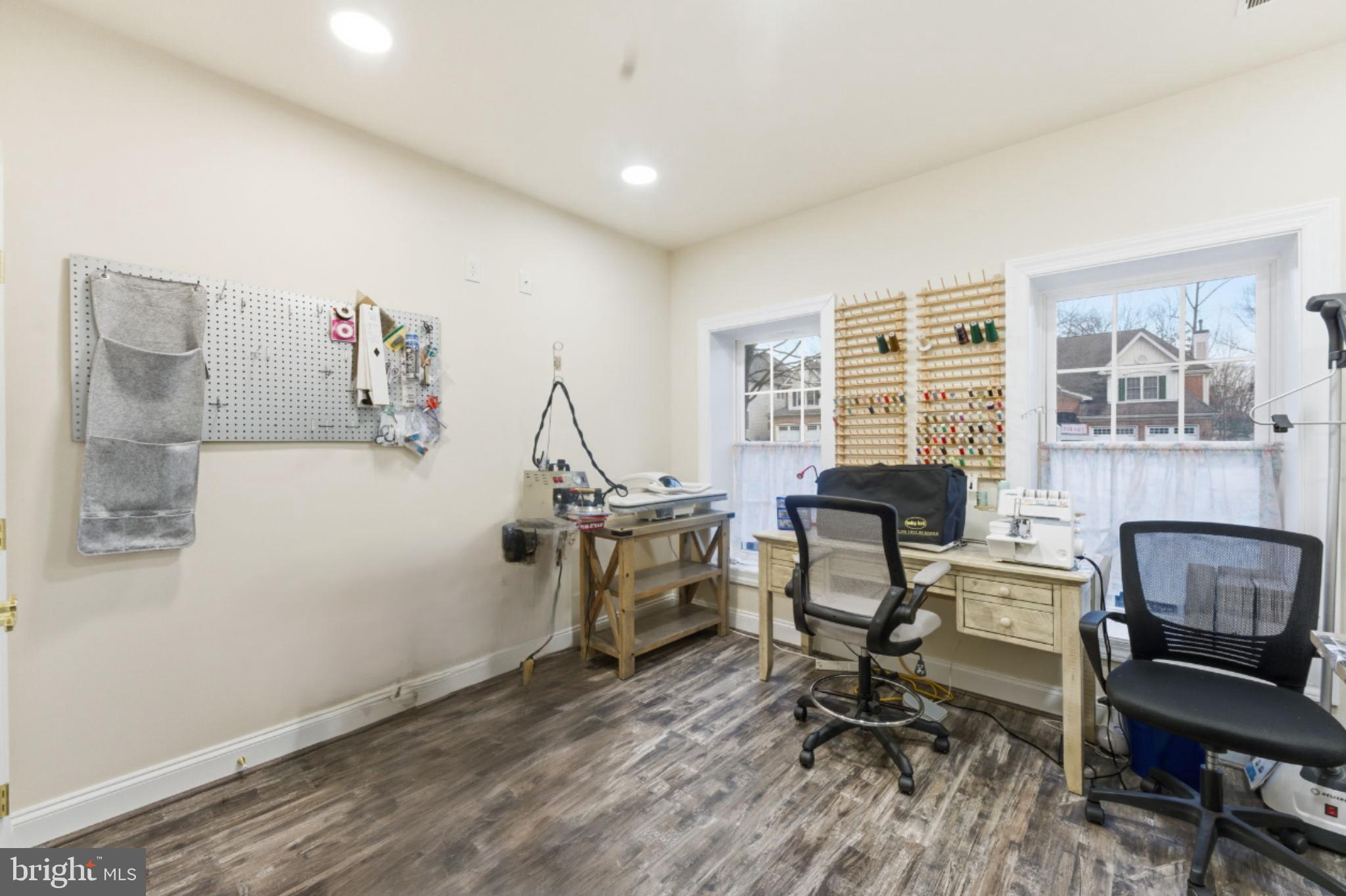 7669 Oak Field Court Springfield, VA 22153 - Photo 51 of 57 a view of a workspace with furniture and a window