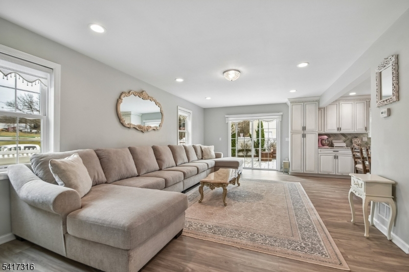 83 White Street Dover, NJ 07801 - Photo 11 of 26 a living room with furniture and a large window
