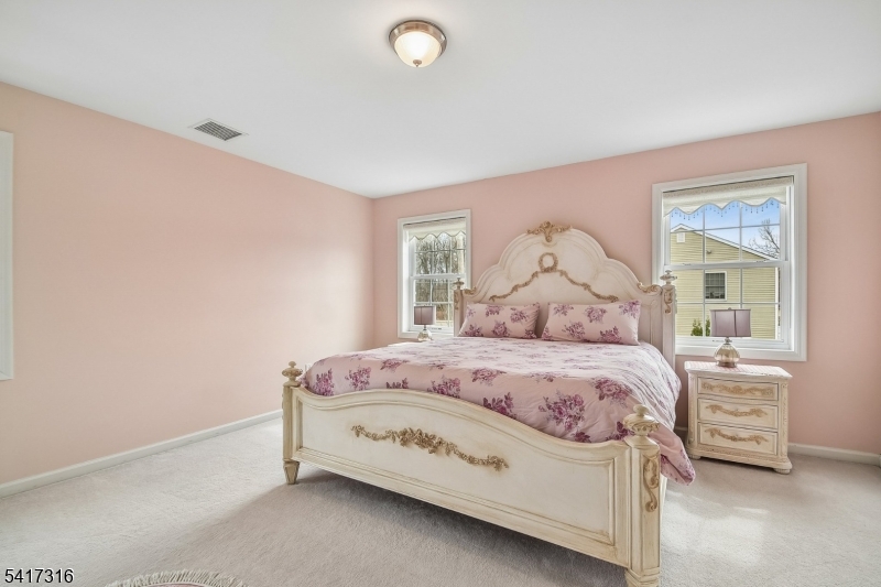 83 White Street Dover, NJ 07801 - Photo 13 of 26 a bedroom with a bed and a window