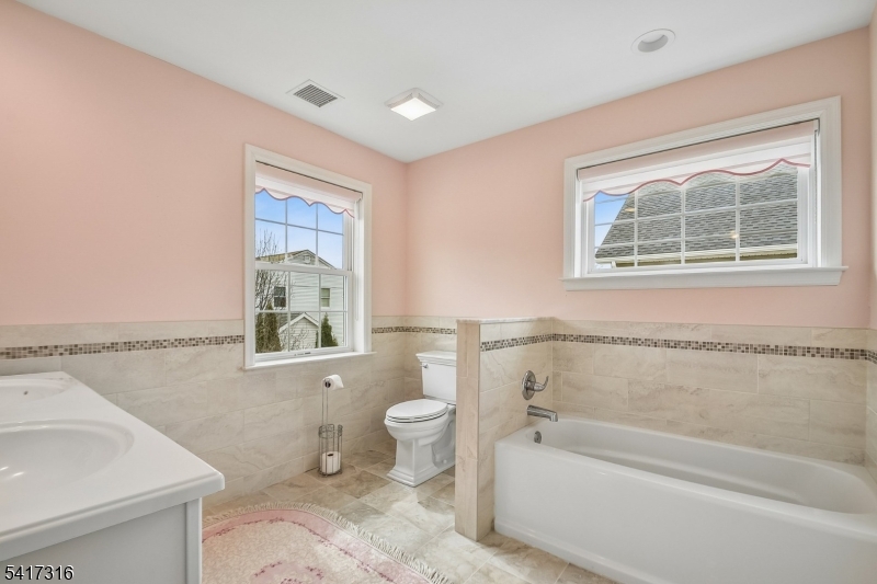83 White Street Dover, NJ 07801 - Photo 15 of 26 a bathroom with a toilet sink and bathtub