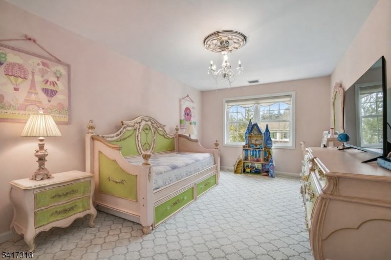 83 White Street Dover, NJ 07801 - Photo 16 of 26 a bedroom with a bed and a mirror