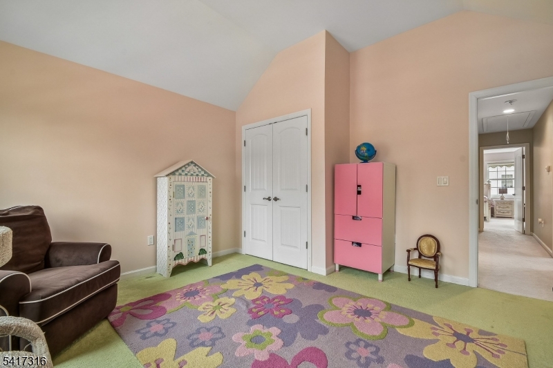 83 White Street Dover, NJ 07801 - Photo 19 of 26 a bedroom with furniture and a rug