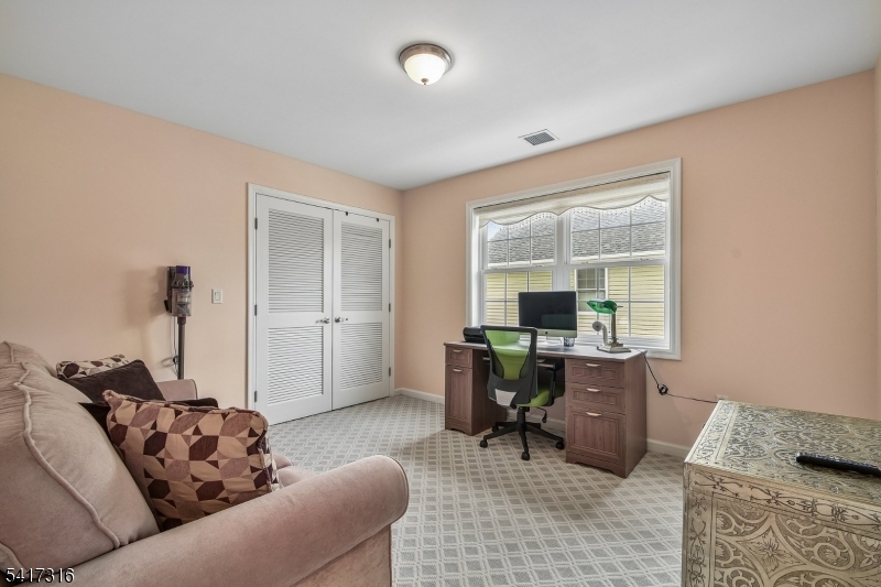 83 White Street Dover, NJ 07801 - Photo 20 of 26 a living room with furniture and a window