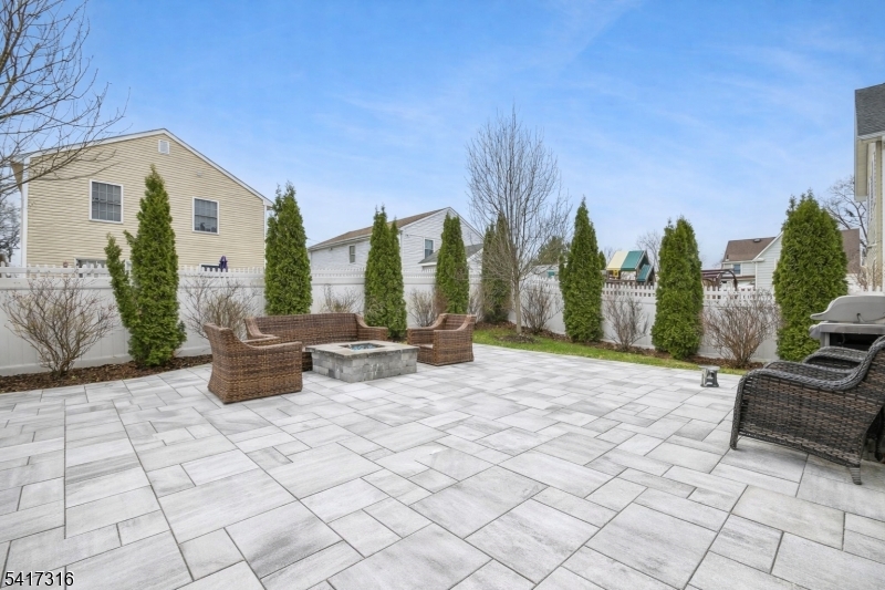 83 White Street Dover, NJ 07801 - Photo 24 of 26 a view of swimming pool with outdoor seating and plants