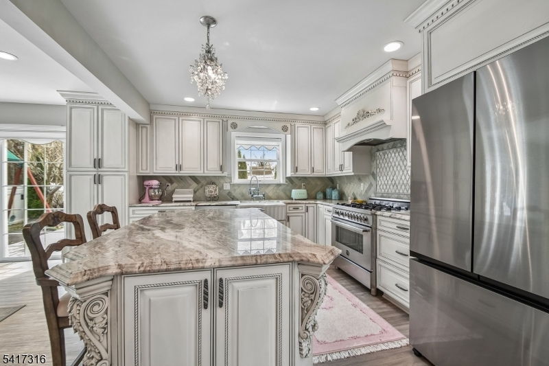 83 White Street Dover, NJ 07801 - Photo 4 of 26 a kitchen with stainless steel appliances granite countertop a sink stove and refrigerator