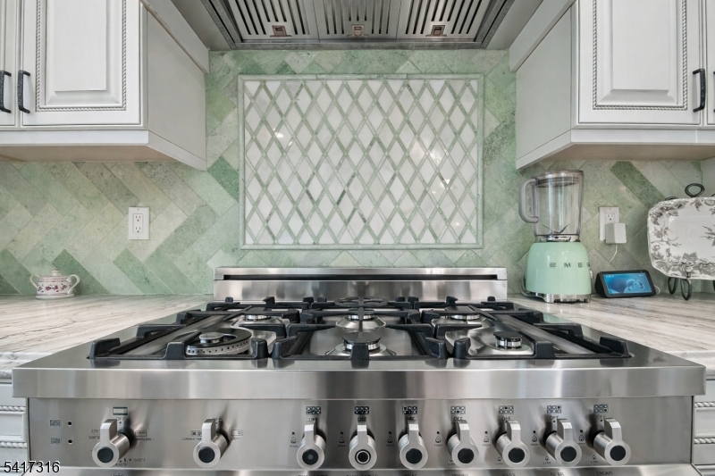 83 White Street Dover, NJ 07801 - Photo 7 of 26 a white stove top oven sitting inside of a kitchen