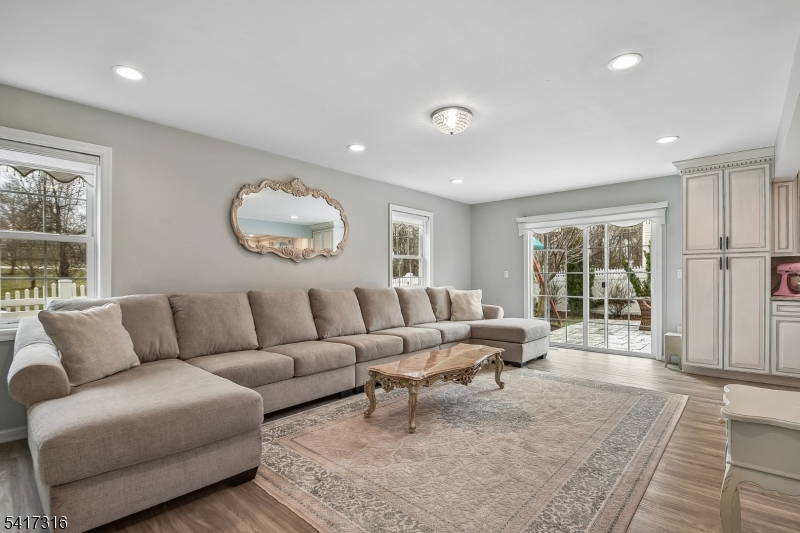 83 White Street Dover, NJ 07801 - Photo 8 of 26 a living room with furniture and a large window