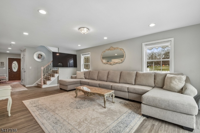 83 White Street Dover, NJ 07801 - Photo 9 of 26 a living room with furniture and a large window