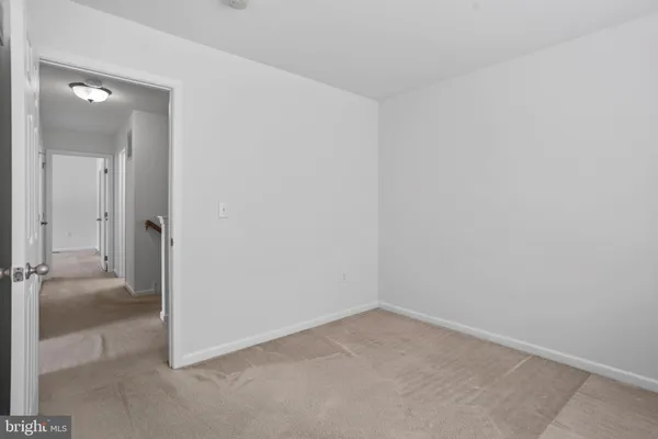 wooden floor and cabinet in an empty room
