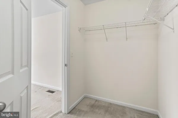 a view of an empty walk in closet