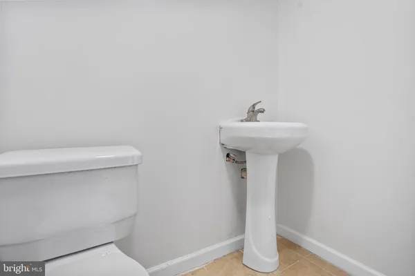 a bathroom with a sink toilet and a