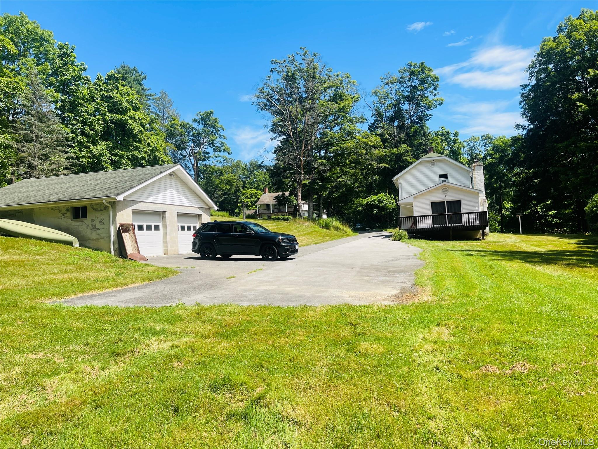 12 Old Turnpike Road Bloomingburg, NY 12721 - Photo 5 of 11 a front view of a house with yard and trees