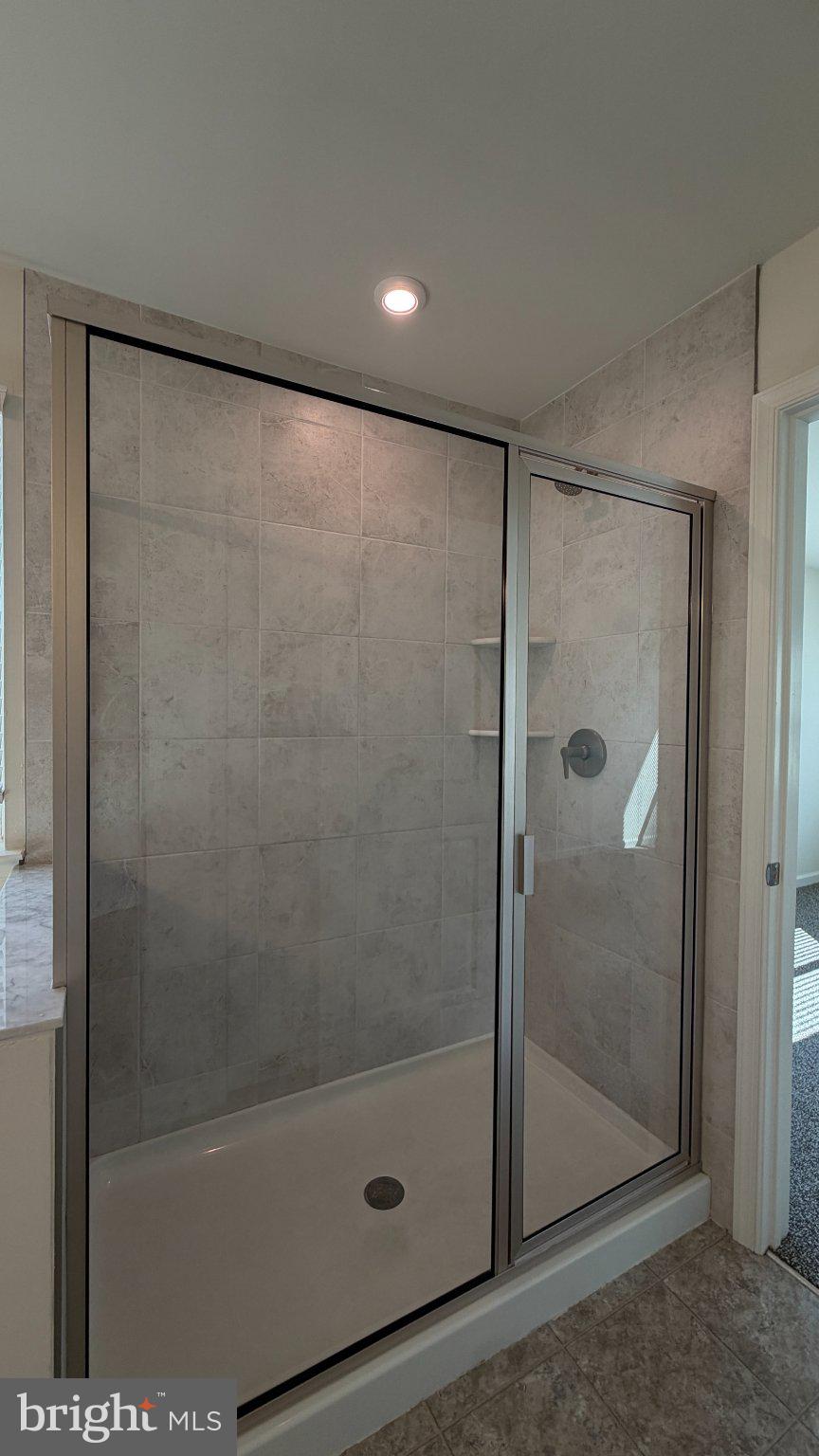 78 Tansboro Road Berlin, NJ 08009 - Photo 20 of 41 a bathroom with a glass shower door