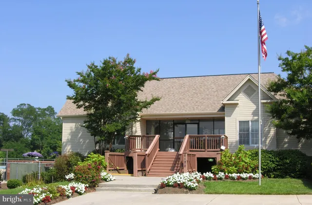 a view of a swimming pool with an outdoor space and seating area