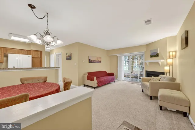 a bedroom with furniture and a chandelier