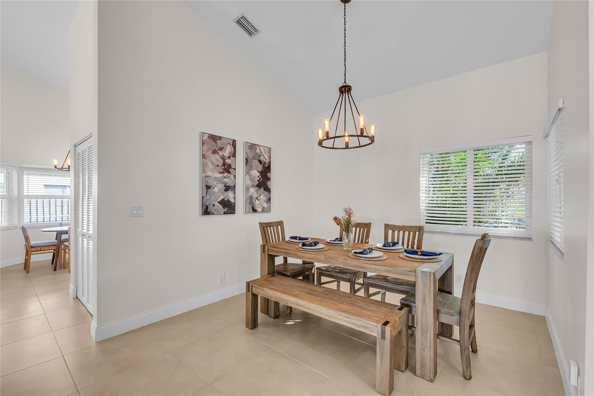 3605 Southwest 23rd Street Delray Beach, FL 33445 - Photo 13 of 50 a dining room with furniture and window