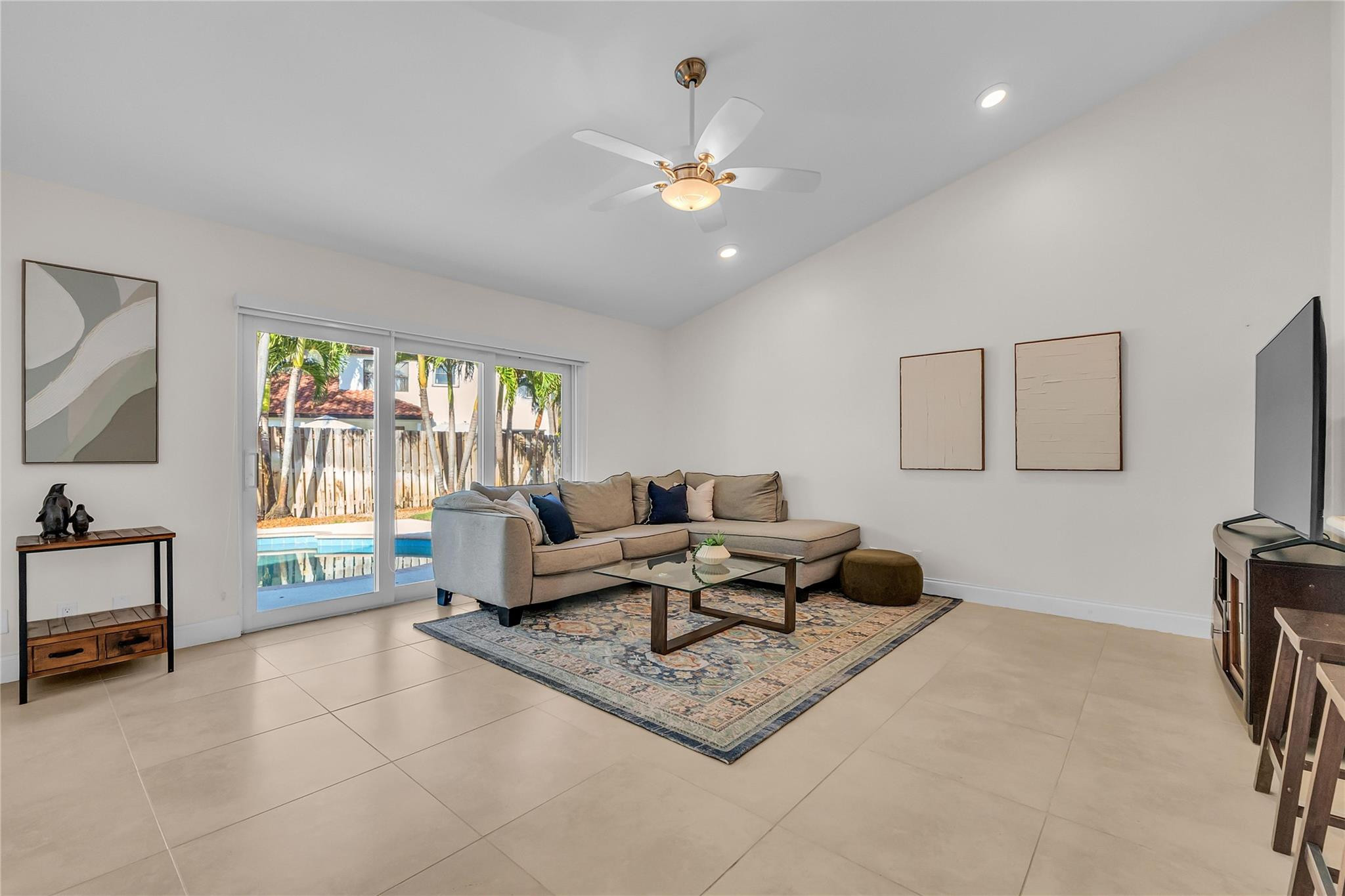 3605 Southwest 23rd Street Delray Beach, FL 33445 - Photo 17 of 50 a living room with furniture and a flat screen tv