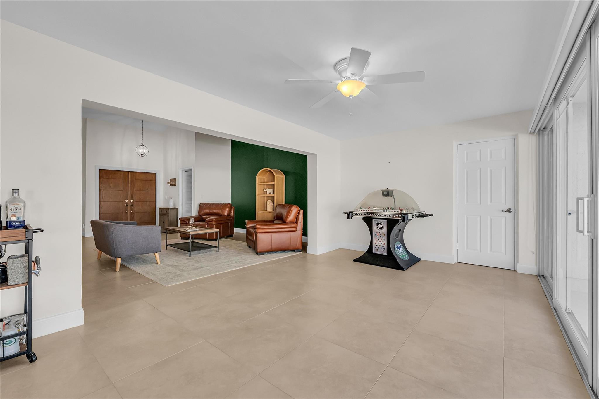 3605 Southwest 23rd Street Delray Beach, FL 33445 - Photo 21 of 50 a living room with furniture and a chandelier