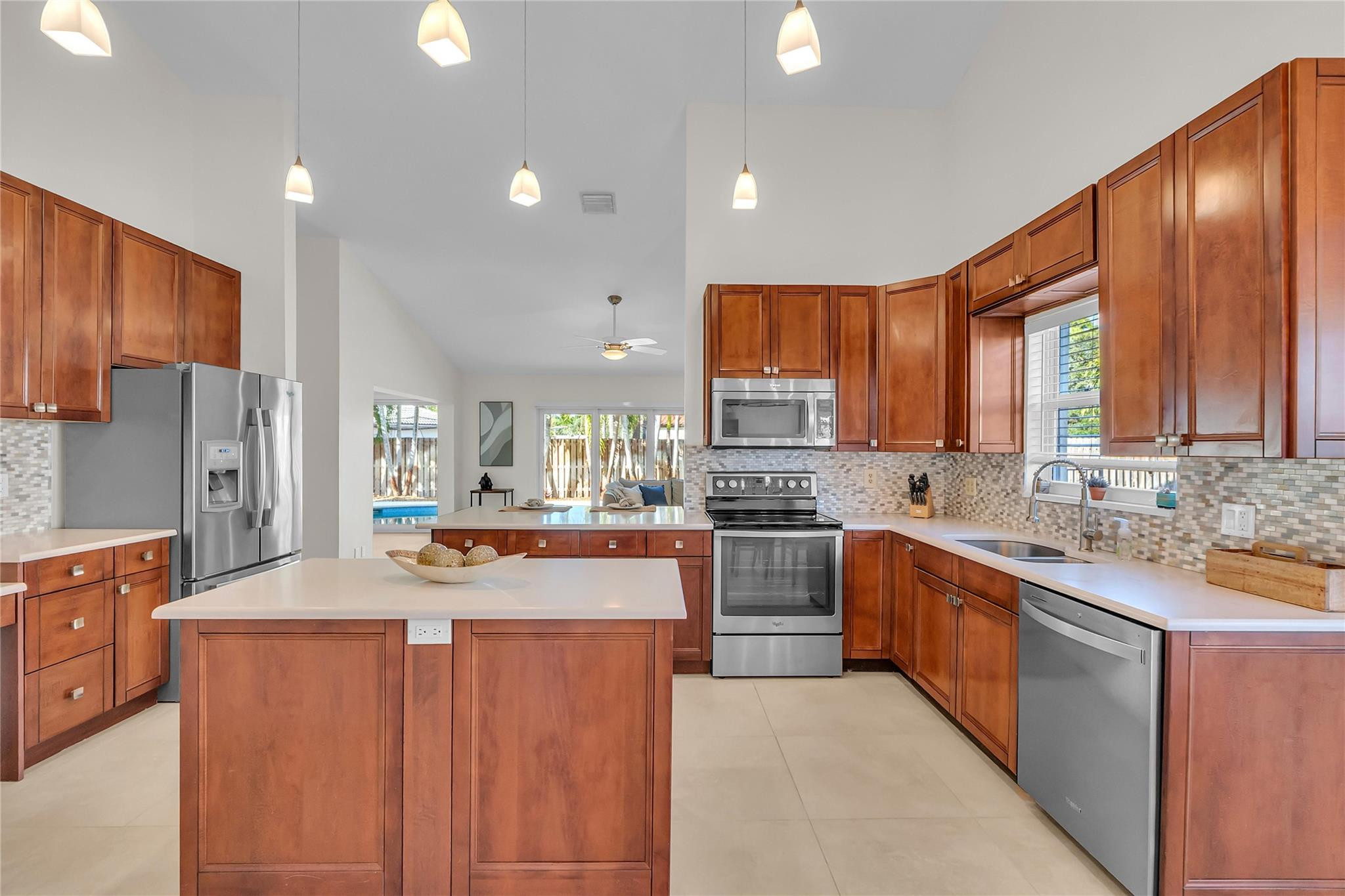 3605 Southwest 23rd Street Delray Beach, FL 33445 - Photo 3 of 50 a large kitchen with stainless steel appliances lots of counter space and a sink