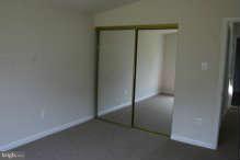 1919 Ritchie Road District Heights, MD 20747 - Photo 9 of 12 Bedroom with mirrored closet doors